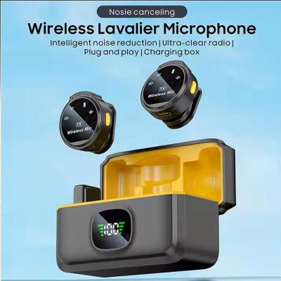 Front view of Q8 wireless clip on microphone showing intelligent noise cancellation button